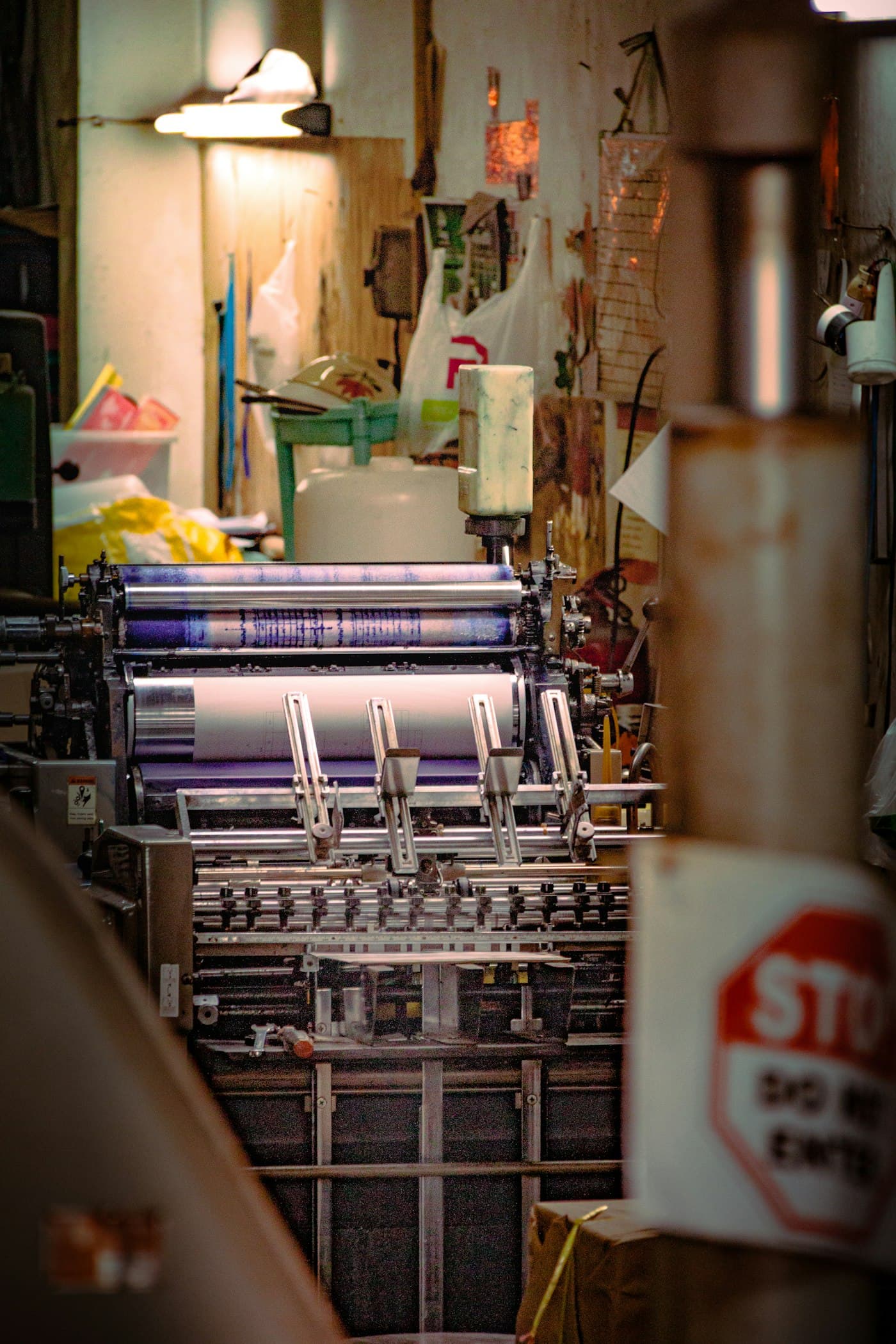 Industrial printing press rollers with ink